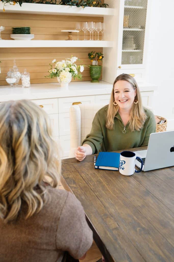 personal finance coach helping a client build a budget